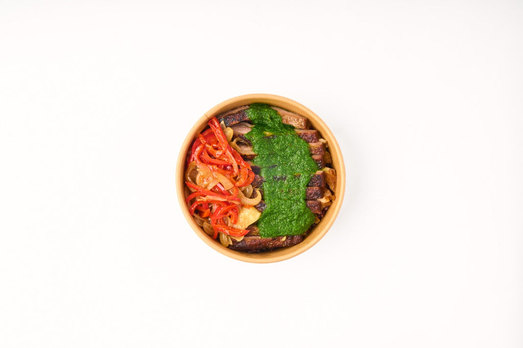 Chimichurri Steak, sautéed bell peppers, caramelized onions