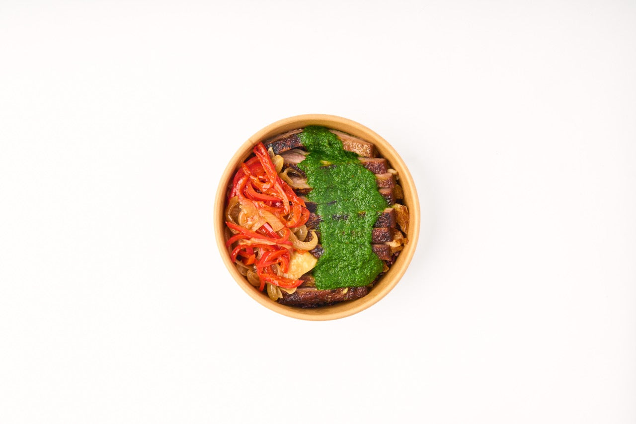 Chimichurri Steak, sautéed bell peppers, caramelized onions